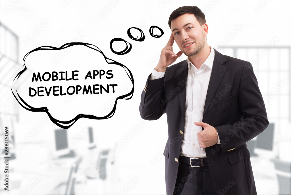 Business, technology, internet and network concept. The young businessman comes up with the keyword: Mobile apps development Business, technology, internet and network concept. The young businessman comes up with the keyword: Mobile apps development