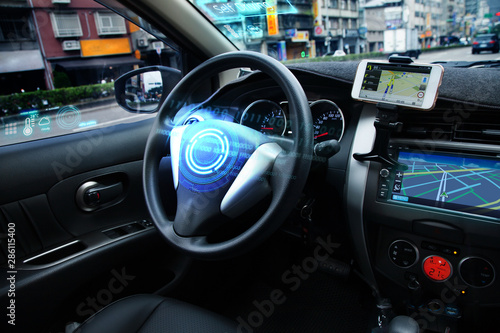 Self Driving car with HUD graphic of AI Autopilot and Navi system is parking near the road while using a sensor to keep safety around the car. Transporation technology, Autonomose vehicle Concept photo