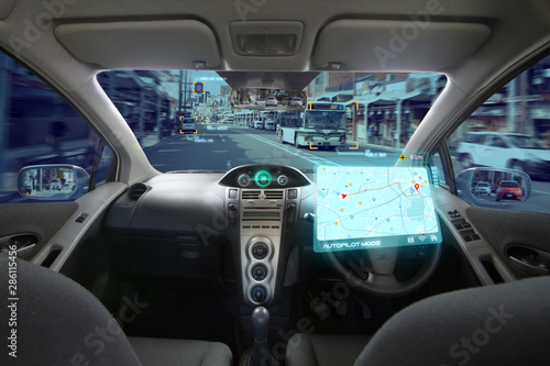 Autonomous car with HUD graphic of Navigation system driving on street in the city by Self Driving Mode. No Driver car and AI Technology with transportation concept. © piyaset