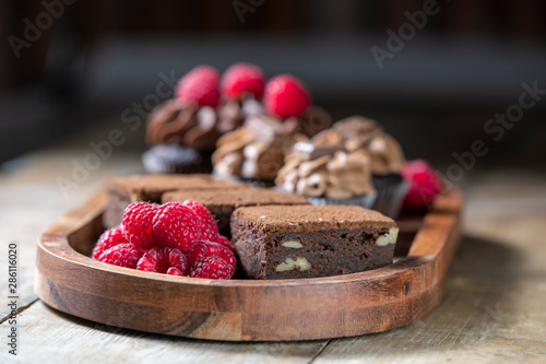 Chocolate Brownies, Raspberries and Cupcakes.