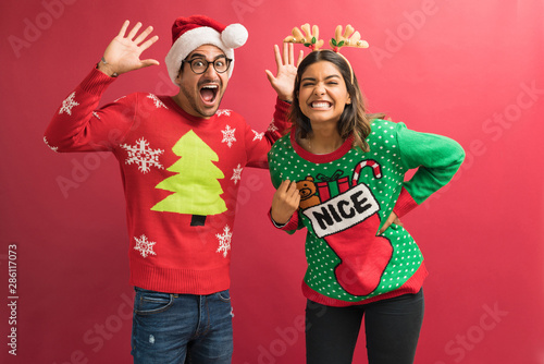 Photos Funny Hispanic Couple In Ugly Sweaters During Christmas