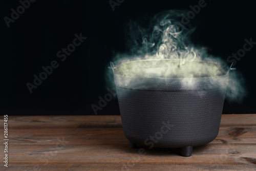 halloween cauldron with smoke photo