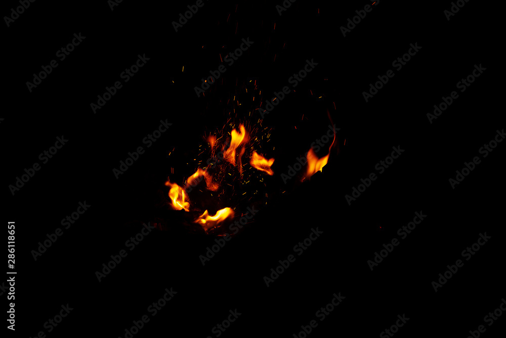 High resolution photo of flame and sparkl on black background. fire flames. Background Texture. Elemen for design abstract of movement of fire flames High resolution photo of flame and sparkl on black background. fire flames. Background Texture. Elemen for design abstract of movement of fire flames