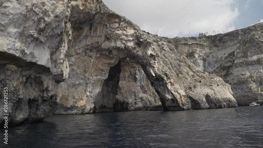 slow motion shot of the Blue Grotto caves, point of view shot from the small boat slow motion shot of the Blue Grotto caves, point of view shot from the small boat