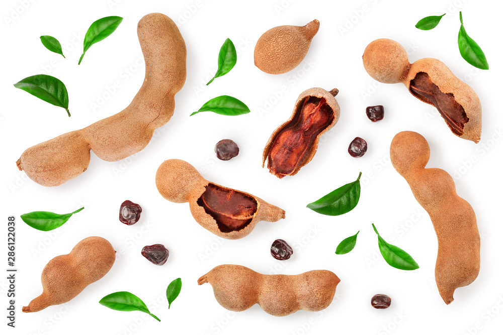 Tamarind fruit with leaf and seed isolated on white background with copy space for your text. Top view. Flat lay Tamarind fruit with leaf and seed isolated on white background with copy space for your text. Top view. Flat lay