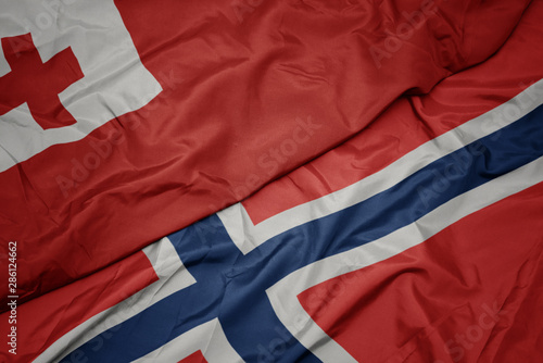 waving colorful flag of norway and national flag of Tonga , .