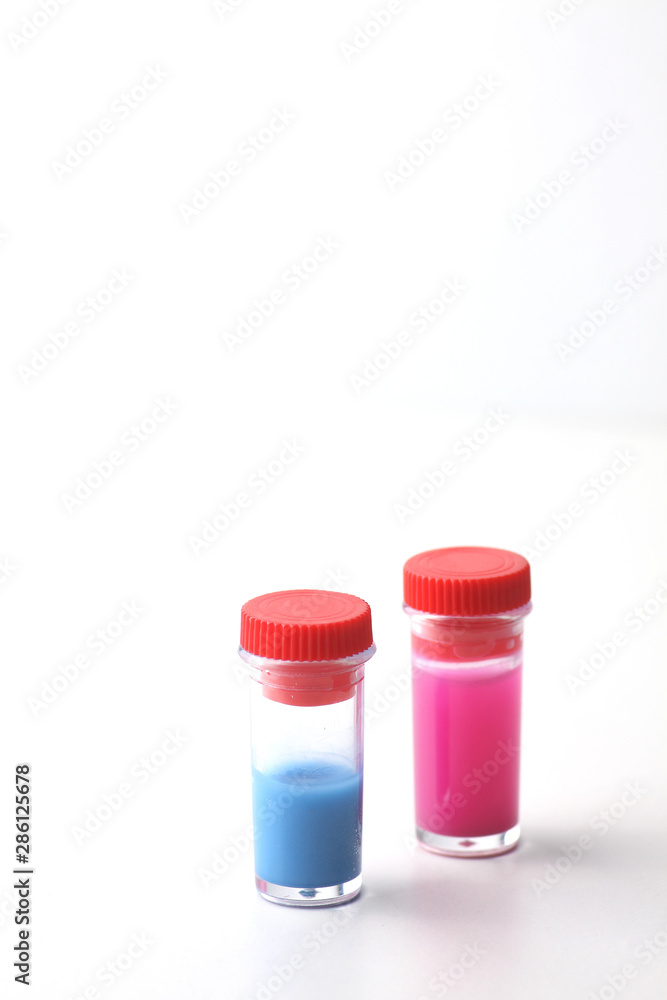 two test-tubes on white background. Image contains copy space two test-tubes on white background. Image contains copy space
