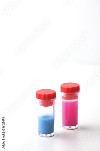 two test-tubes on white background. Image contains copy space