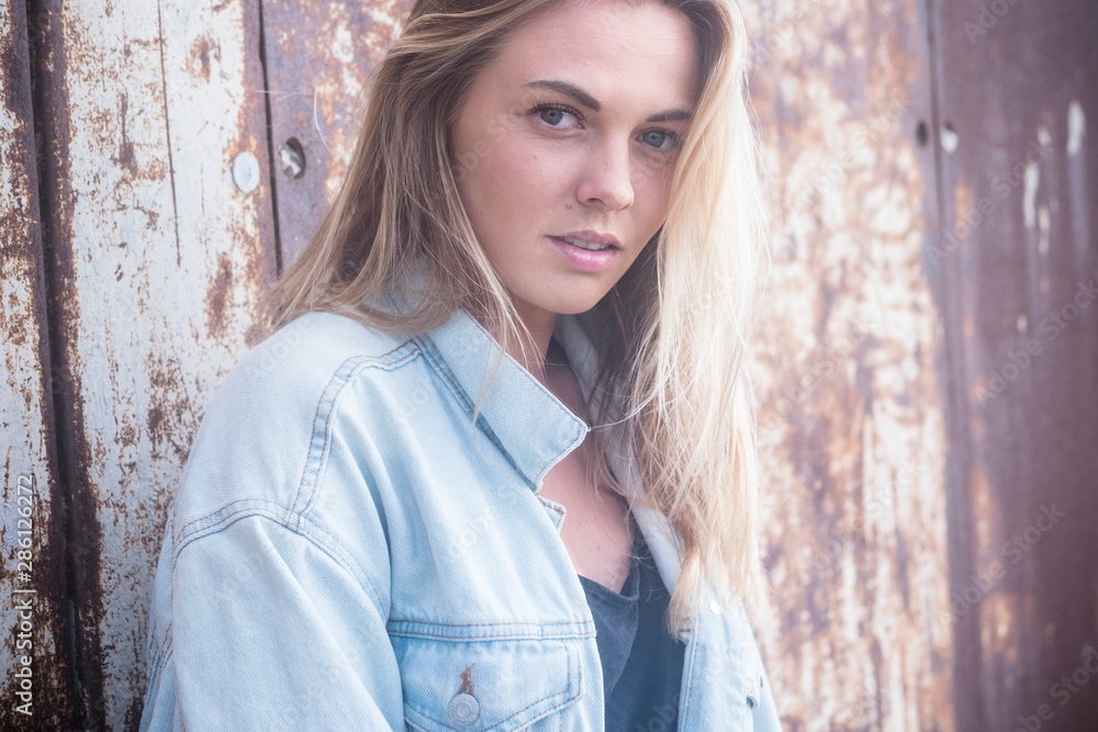 beautiful girl looking at the camera - portrait with van in the background - pretty teenager caucasian beautiful girl looking at the camera - portrait with van in the background - pretty teenager caucasian