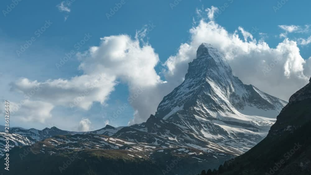 Timelapse of clouds and Matterhorn mountain at summer evening in Zermatt, Switzerland Timelapse of clouds and Matterhorn mountain at summer evening in Zermatt, Switzerland