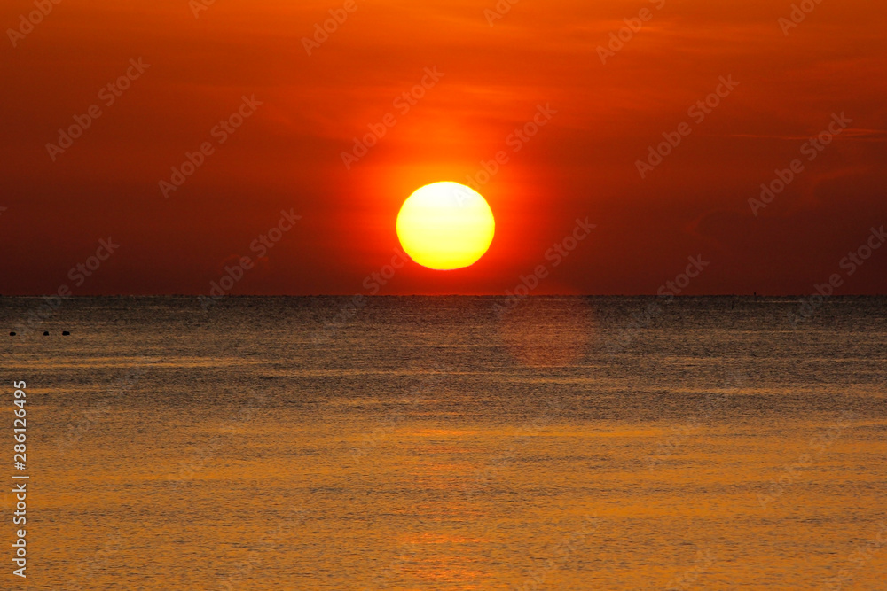 peaceful ocean with beautiful sunrise background