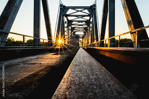 Railroad bridge in sunrise. Railway bridge at dawn.