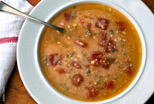 Close up of tomato straciatella soup served in bowl photo