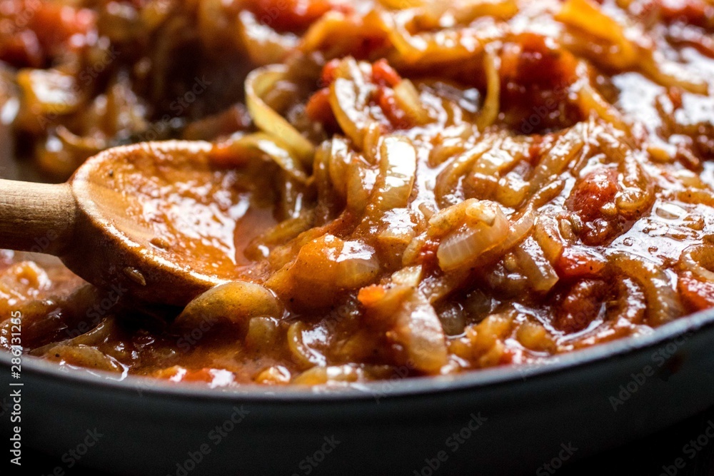 Close up of cheddar and spiced onion pasta in saucepan Close up of cheddar and spiced onion pasta in saucepan