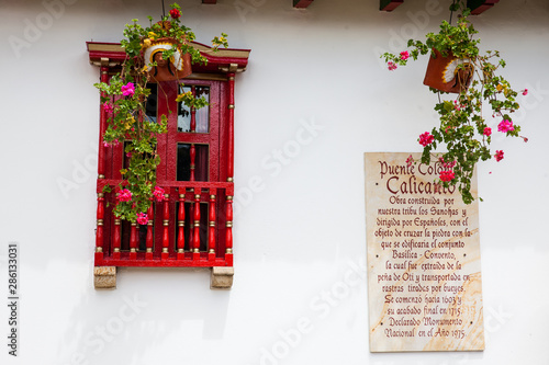 Sign telling the story of the Royal Bridge of Calicanto at the small town of Mongui in Colombia