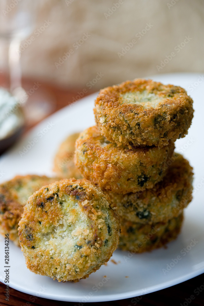 Close up of potato, salmon and spinach patties served on plate Close up of potato, salmon and spinach patties served on plate