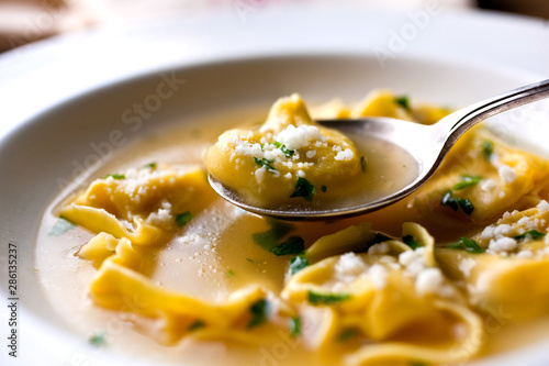 Close up of tortellini in turkey broth