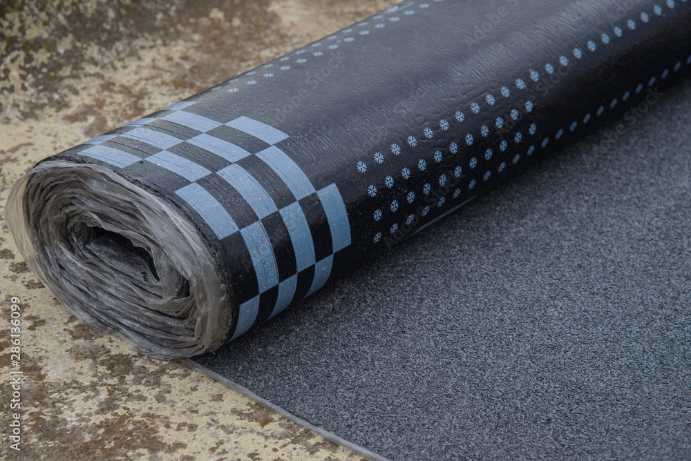 Waterproof bitumen roll covered with insulation materials. Stock Photo