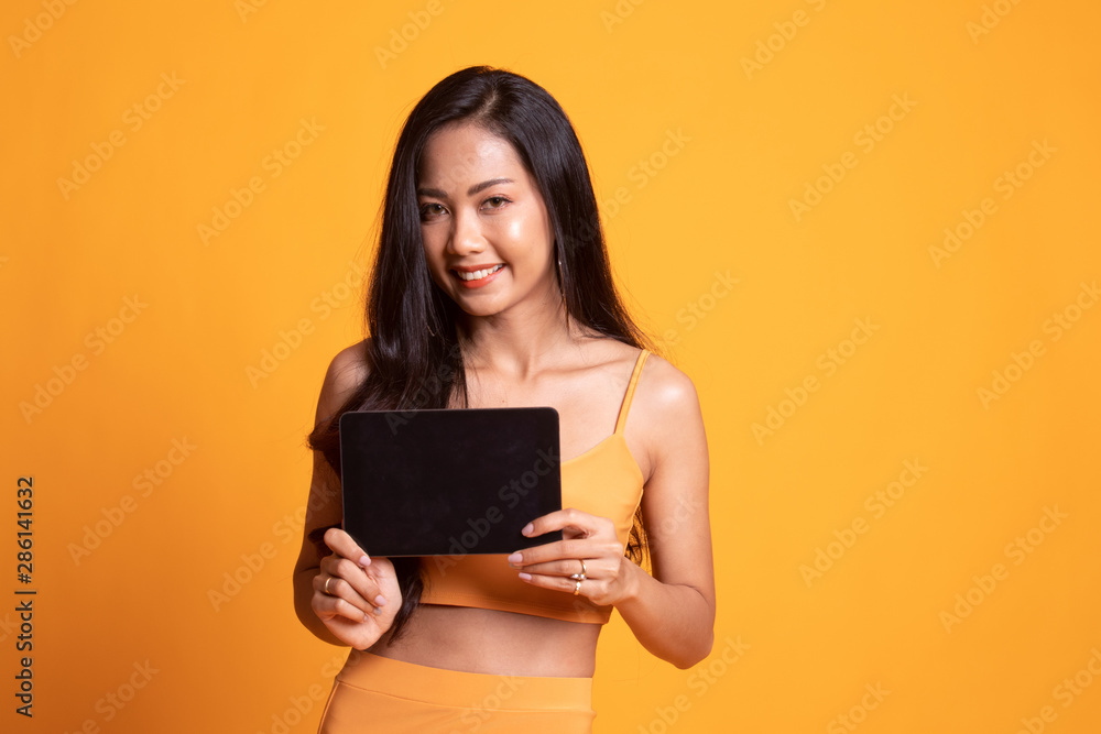 Young Asian woman with a computer tablet. Young Asian woman with a computer tablet.