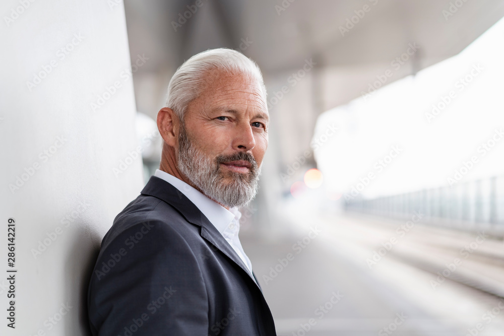 Portrait of mature businessman at the station platform Portrait of mature businessman at the station platform