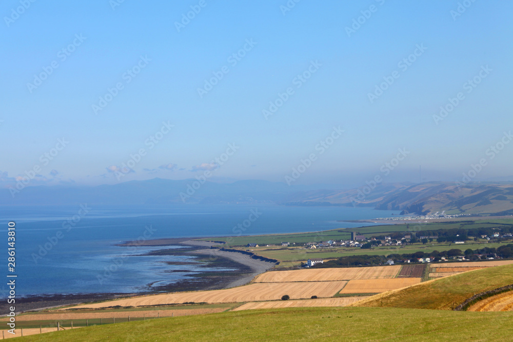 View over Cardigan bay landscape with the village of llanon in the distance