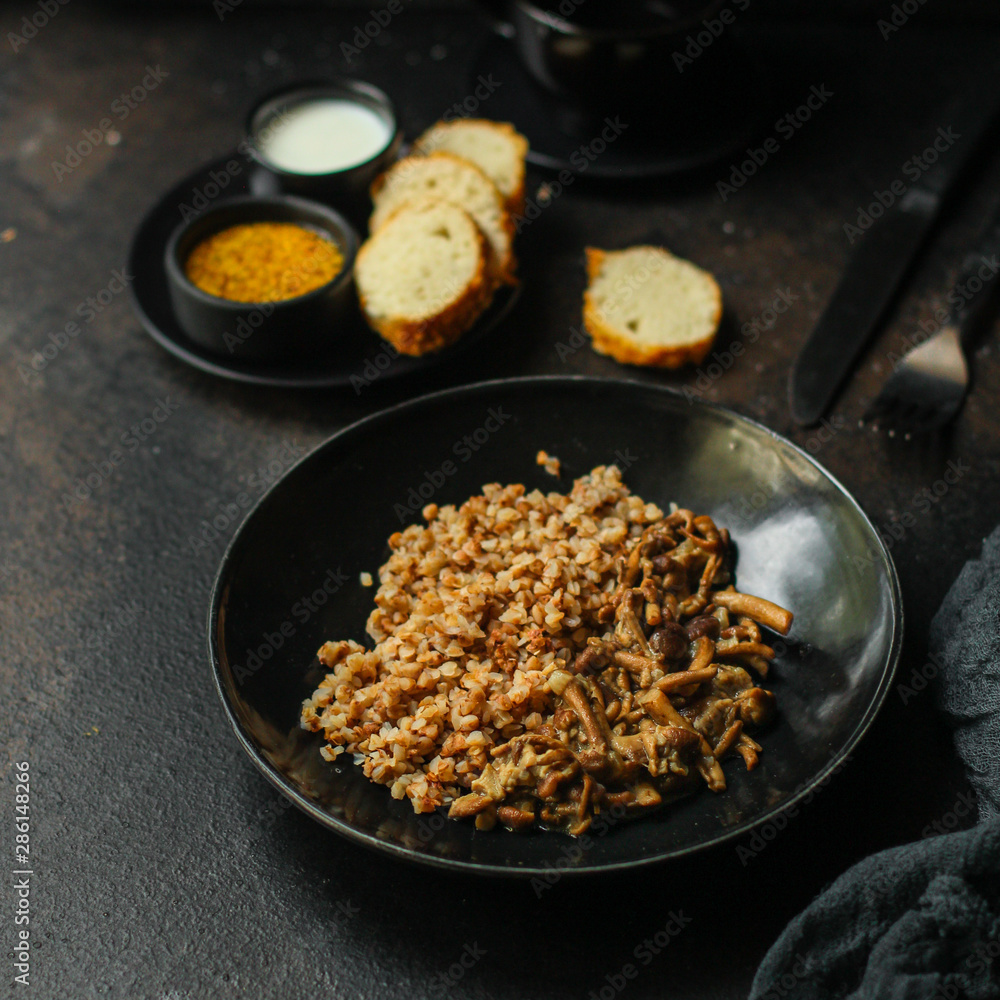 buckwheat with mushrooms (buckwheat porridge, no meat) vegetarian menu. top food background. copy space buckwheat with mushrooms (buckwheat porridge, no meat) vegetarian menu. top food background. copy space