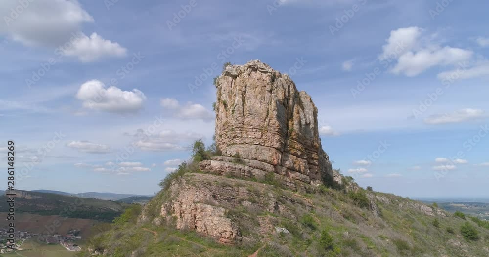 Roche de Solutré with tourists, climb up. Burgundy, France Roche de Solutré with tourists, climb up. Burgundy, France