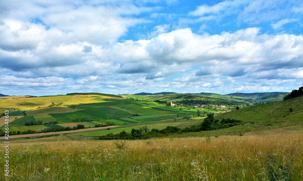 A beautiful rural landscape in Transylvania. Village of Hodosa Mures county - Romania
A beautiful rural landscape in Transylvania. Village of Hodosa Mures county - Romania