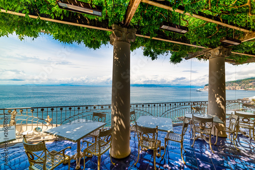Fototapeta Naklejka Na Ścianę i Meble -  Tables and chairs on a beautiful terrace in Sorrento