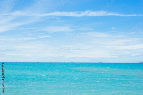 View of beautiful white clouds in a blue sky,blue sea on sunny day with cloudy sky over it.