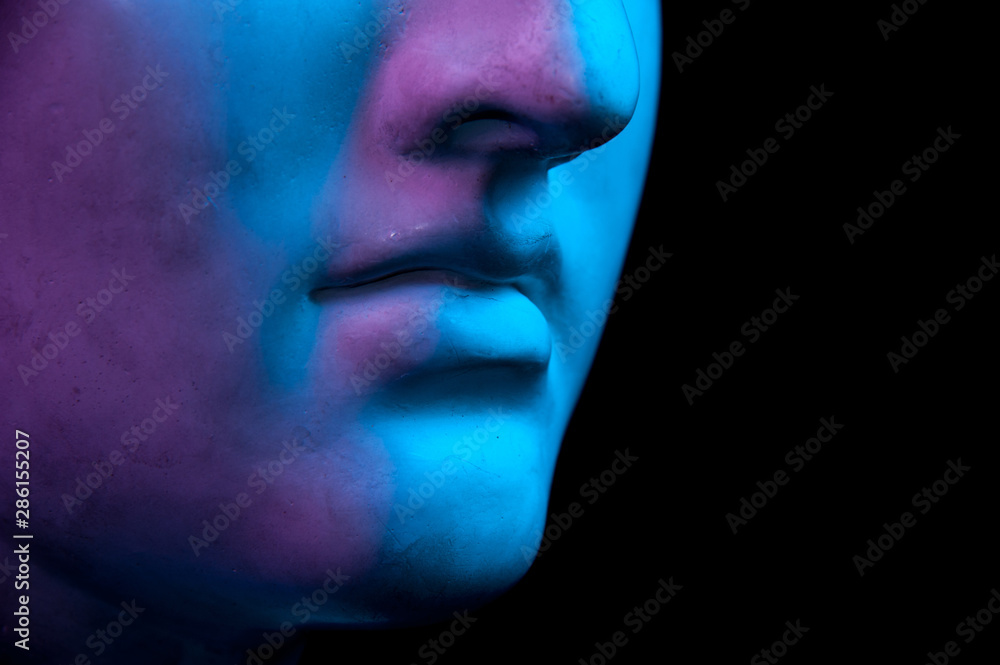 Gypsum copy of ancient statue Diana head isolated on black background. Close up view lips. Toned. Gypsum copy of ancient statue Diana head isolated on black background. Close up view lips. Toned.