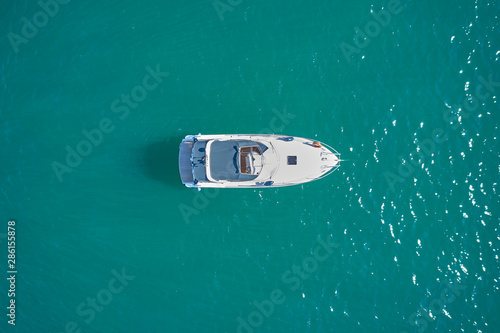 white yacht on blue water top view © Berg