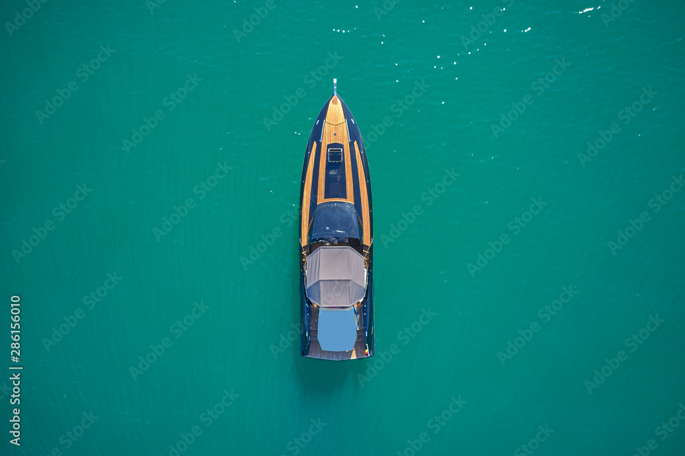 luxury yacht on blue water top view luxury yacht on blue water top view