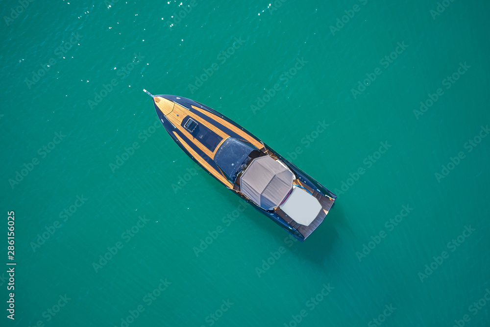 luxury yacht on blue water top view luxury yacht on blue water top view