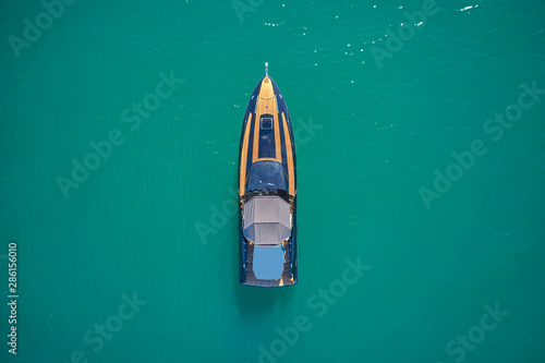 luxury yacht on blue water top view © Berg