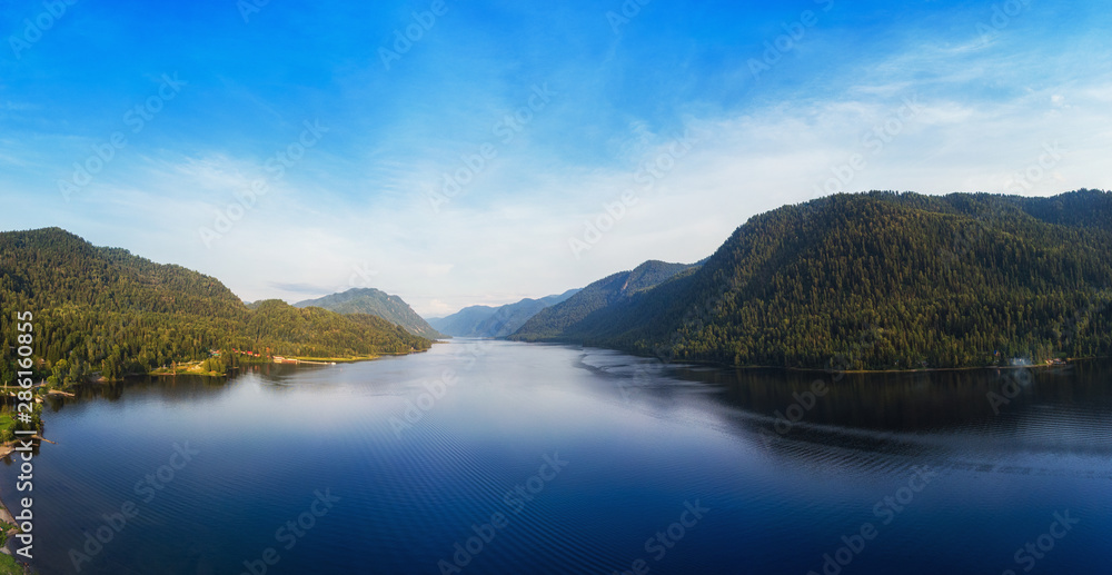 Aerial view on Teletskoye lake in Altai mountains, Siberia, Russia. Drone shot. Beauty panoramic picture in summer day.