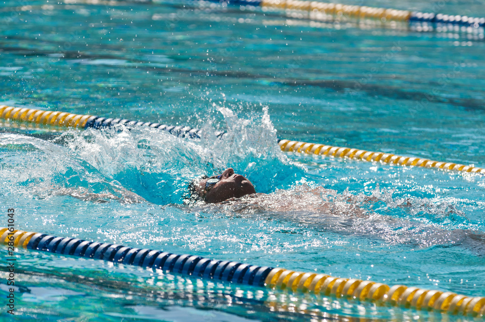 A Paraplegic man Swims In a Pool