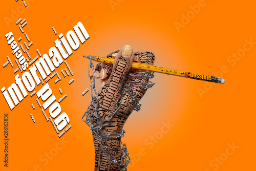 Chained female hand with words like tattoos are keeping yellow pencil on the orange background. There are words - information, gold, society. World Information Day.