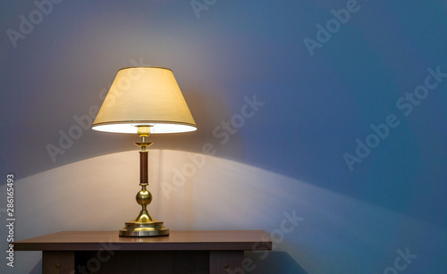 Table lamp near wall