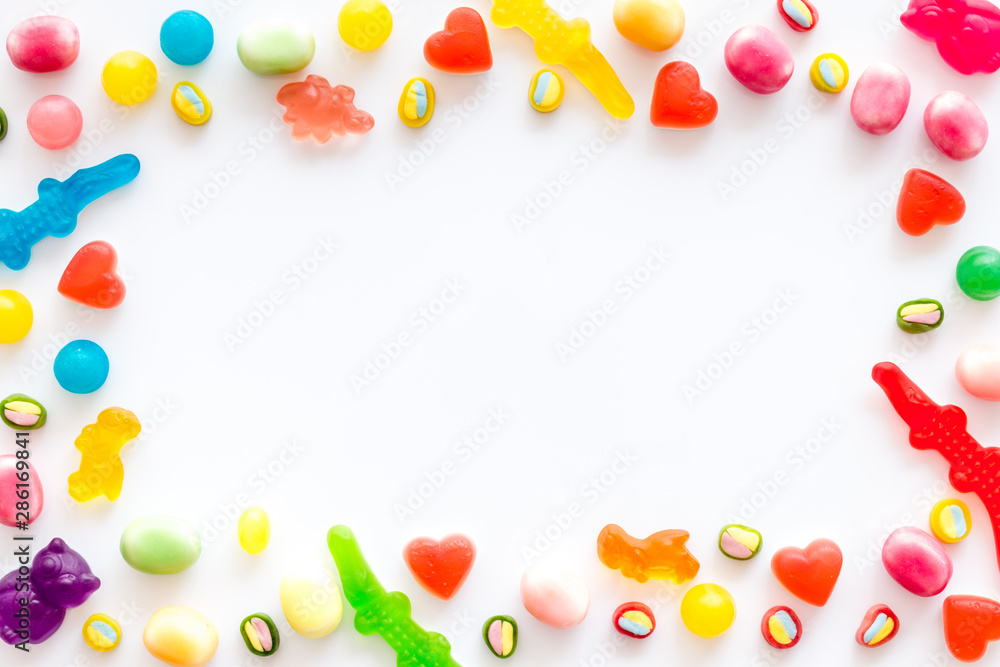 Candies frame for party design on white background top view copyspace