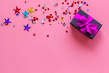 box for gifts with confetti on pink background top view mockup