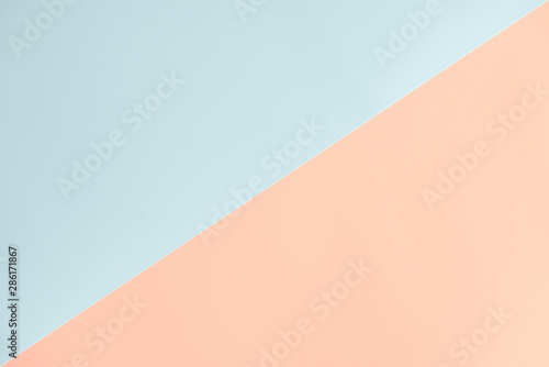 Blue and orange pastel color paper geometric flat lay background