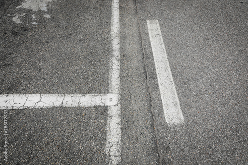 marks on a asphalt, street marks painted white as a background isolated