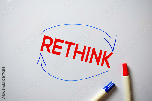 Photography Rethink text with arrows isolated on white board background.