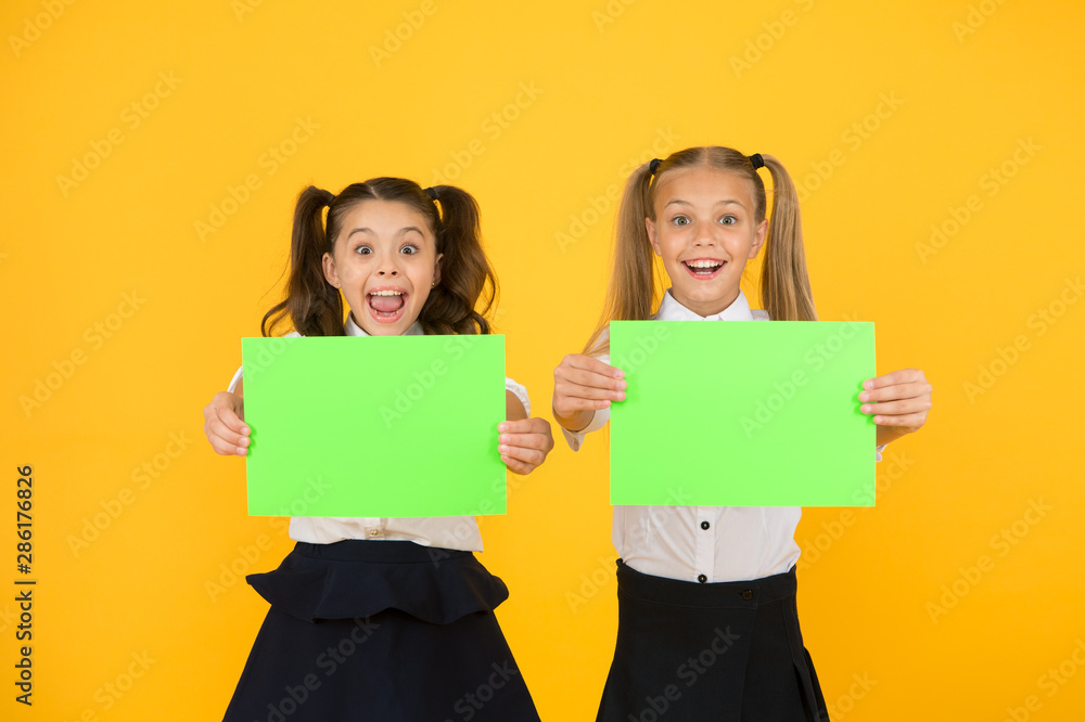 School socialization. Girls school uniform hold poster. Back to school concept. Schoolgirls classmates friends. Kids relations. Criticisms homeschooling children might not get opportunity socialize School socialization. Girls school uniform hold poster. Back to school concept. Schoolgirls classmates friends. Kids relations. Criticisms homeschooling children might not get opportunity socialize