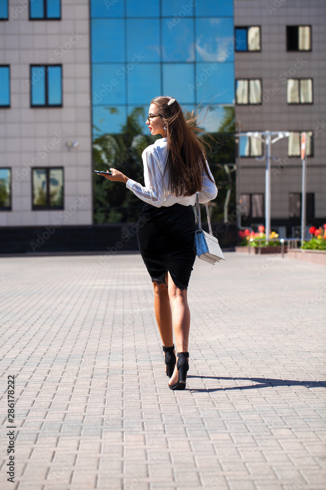 Young brunette woman calling by phone Young brunette woman calling by phone