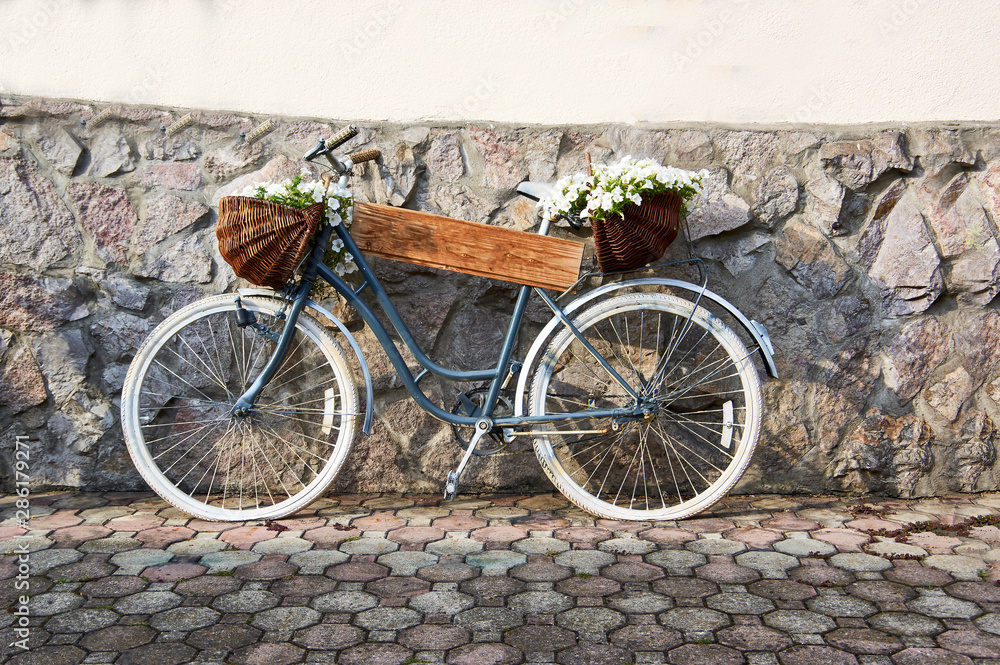 A old bicycle with basket, as devorative thng..