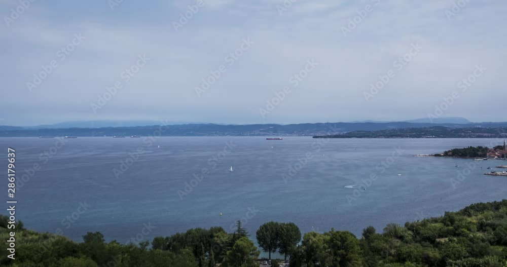 Time lapse of Piran bay on summer day with boats and a large tankers on sea. Time lapse of Piran bay on summer day with boats and a large tankers on sea.