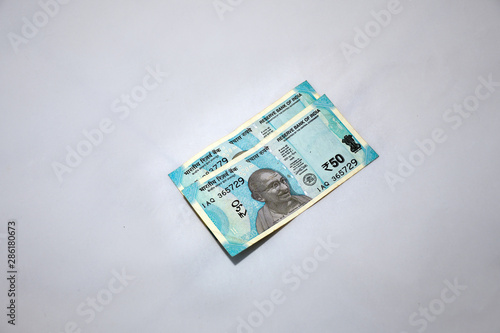 Modern Indian fifty Rupees Currency Notes on a minimal light gray background