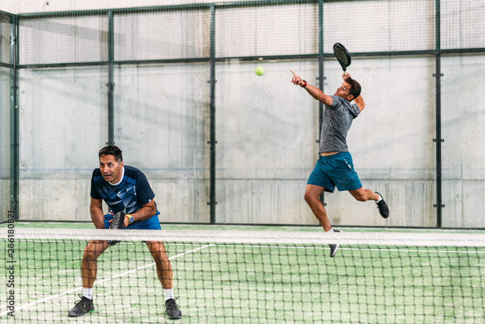 Men playing padel Men playing padel